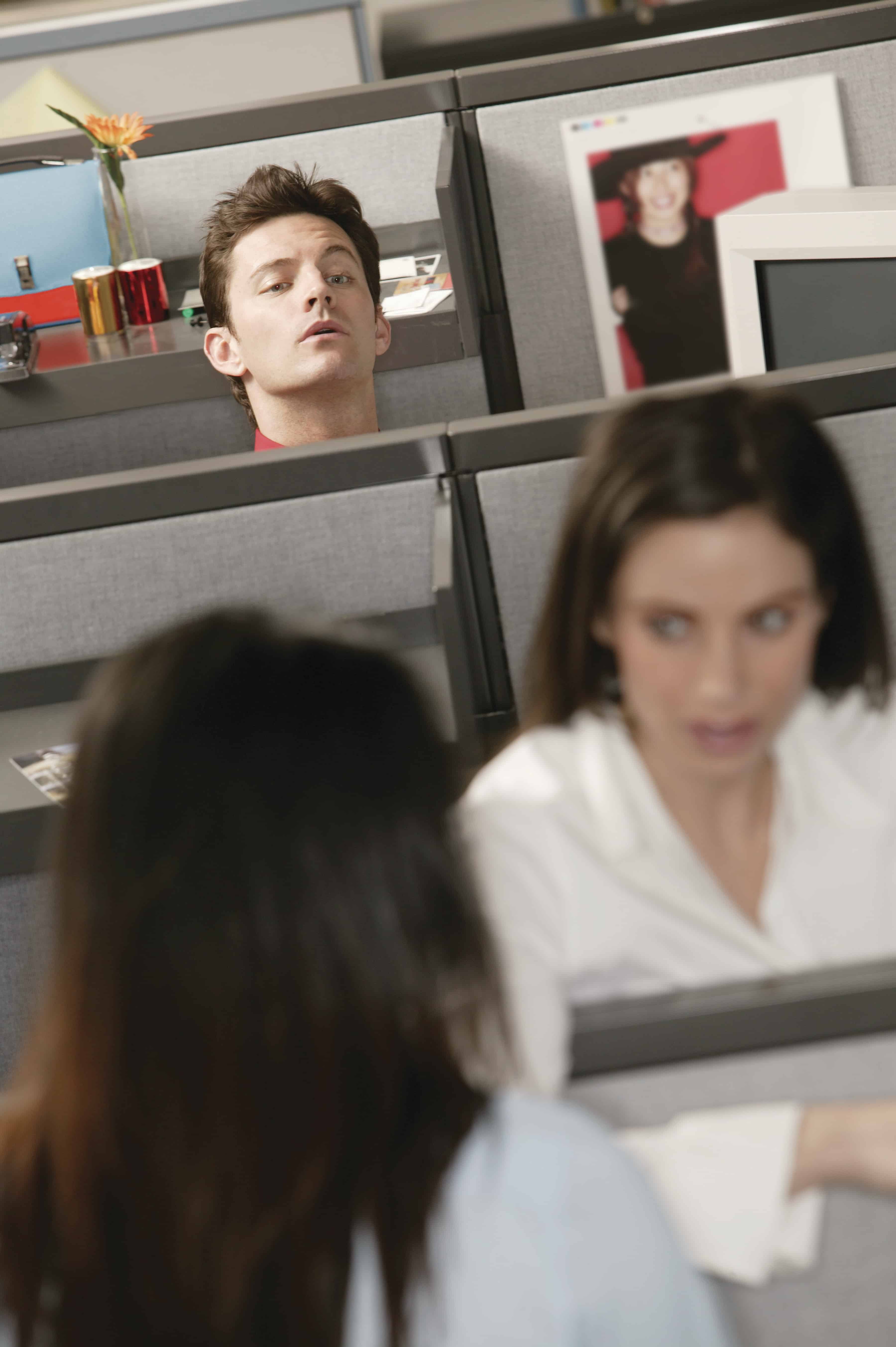 gossiping women in office cubical